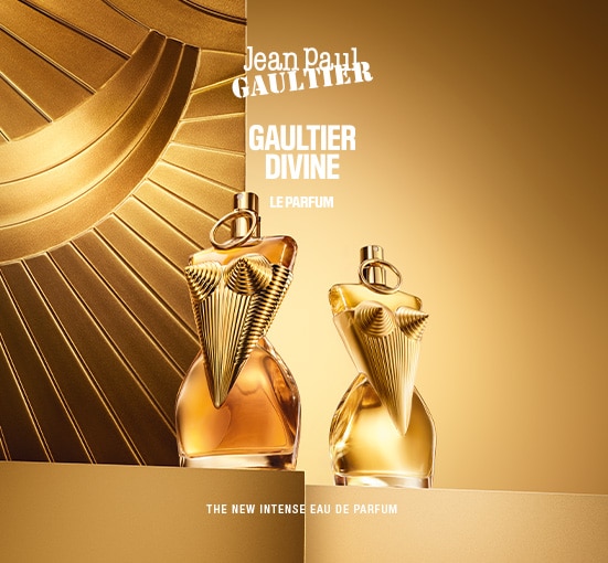 Jean Paul Gaultier Divine Le Parfum - Nuovo profumo intenso con flaconi dorati su sfondo a raggi solari.